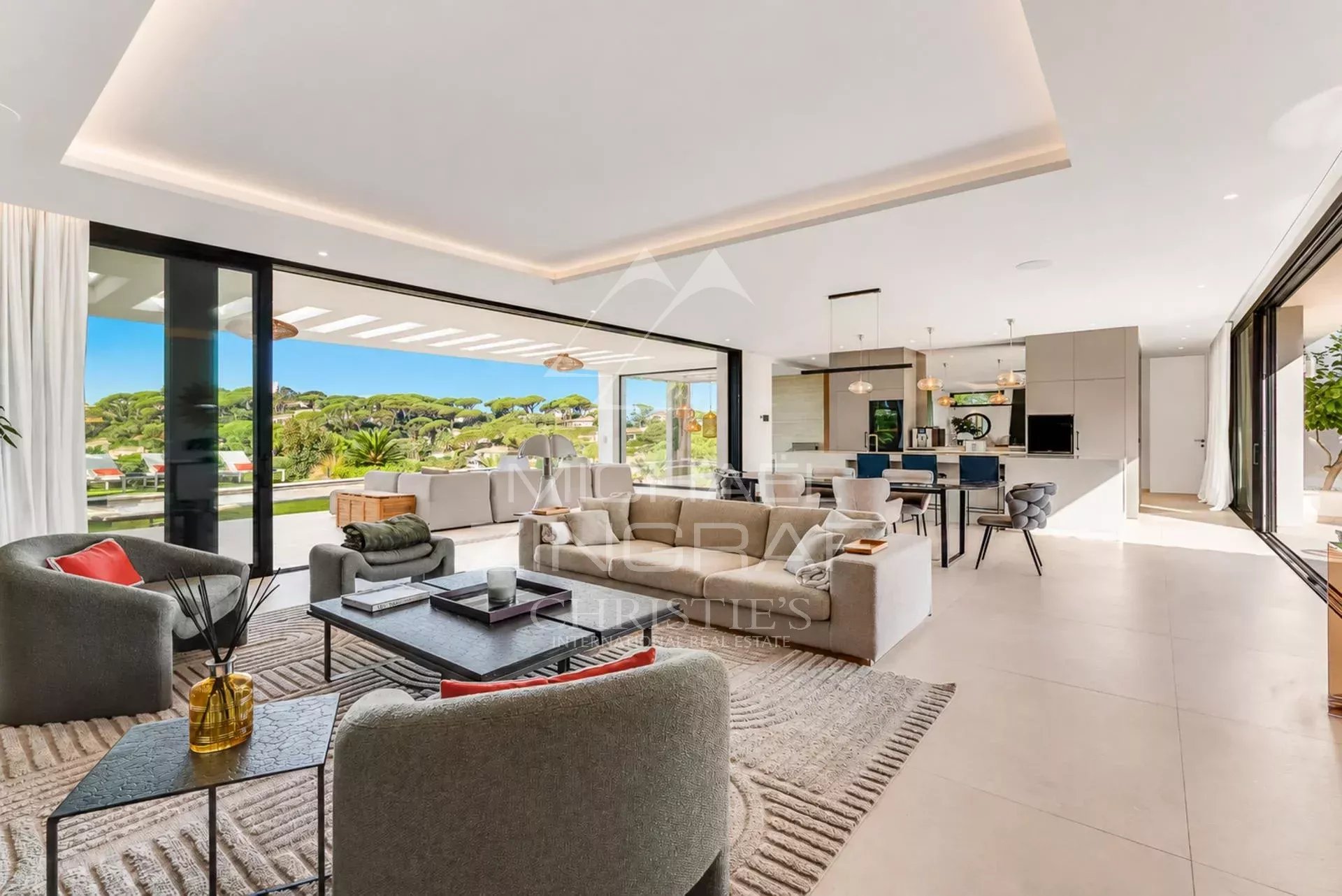 Interior of a contemporary villa in Sainte-Maxime Interior of a contemporary villa with views of the landscape, modern and bright living room.