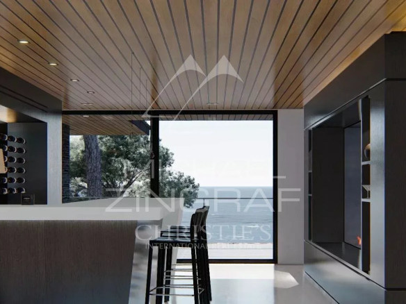 Intérieur moderne d'une propriété avec bar et vue sur la mer au Lavandou.