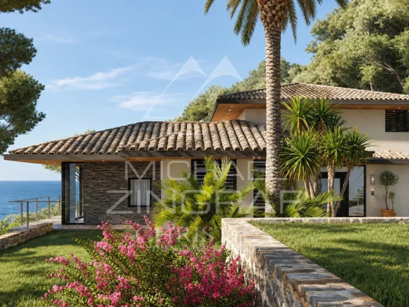Maison moderne avec vue sur la mer, entourée de verdure et de fleurs au Lavandou.