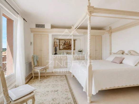 Elegant room with four-poster bed and sea view in Sainte-Maxime.