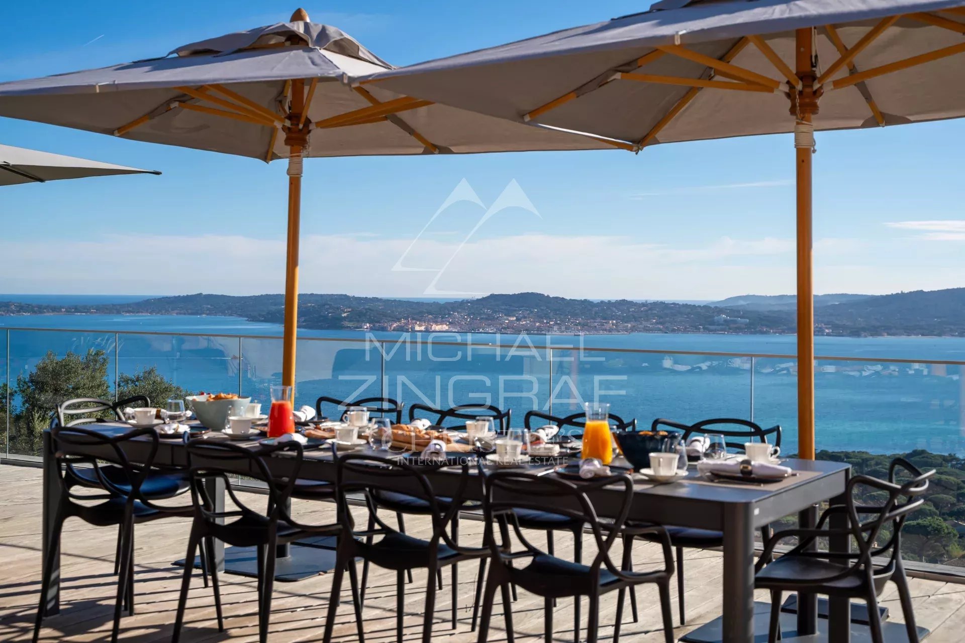 Terrace of Villa Levante Terrace with set table and view of the Gulf of Saint-Tropez from Villa Levante in Grimaud.