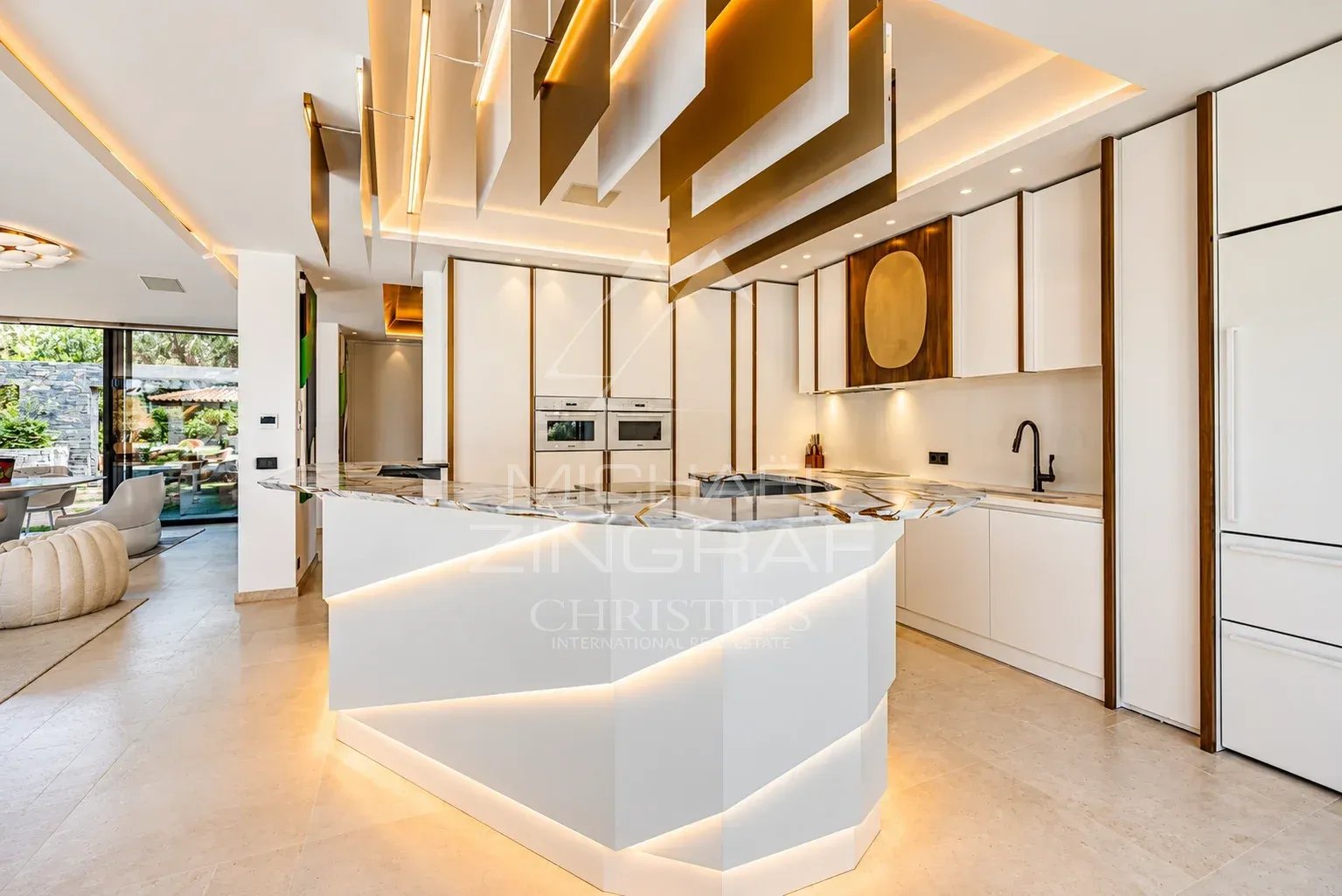 Modern interior of a villa with fitted kitchen and bright space in Ramatuelle.