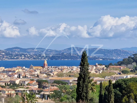 Panoramic view of the Gulf of Saint-Tropez and the village from a contemporary villa.