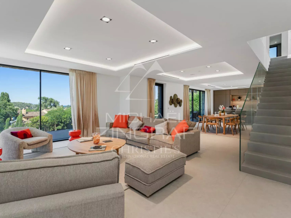 Interior of a contemporary villa in Saint-Tropez with sea view, modern and bright living room.