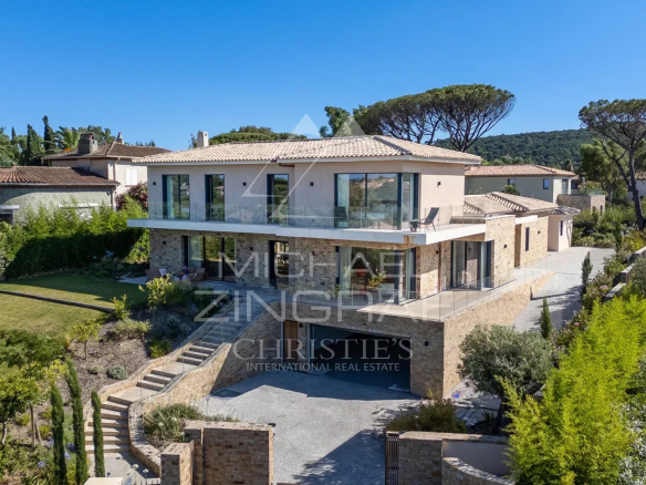 Contemporary villa with sea views in Saint-Tropez, surrounded by greenery and outdoor spaces.