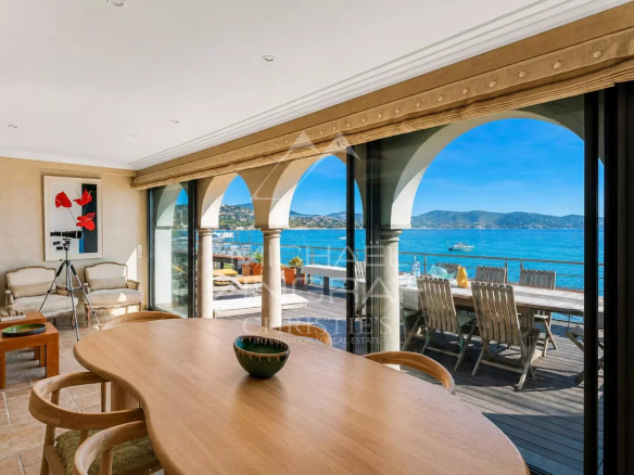 Interior of a villa with sea views in Sainte-Maxime, bright dining room.