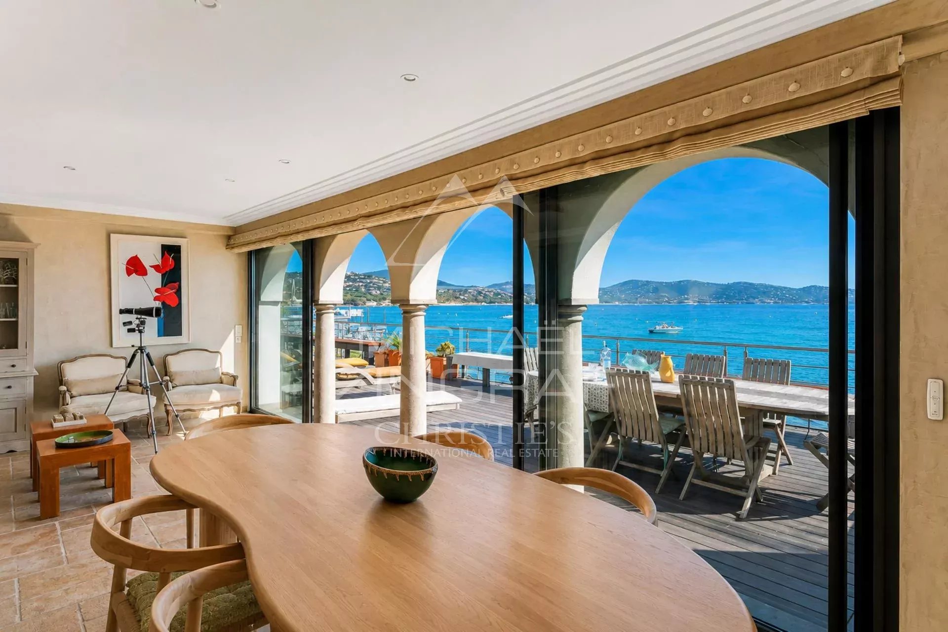 Waterfront villa in Sainte-Maxime Interior of a villa with sea views in Sainte-Maxime, bright dining room.