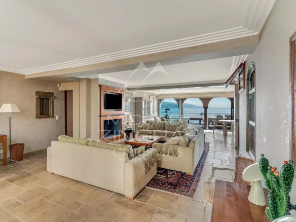 Interior of a villa in Sainte-Maxime with sea view, spacious and bright living room.