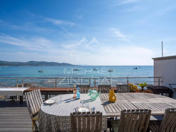 Terrace with sea view in Sainte-Maxime, table set for an outdoor meal.
