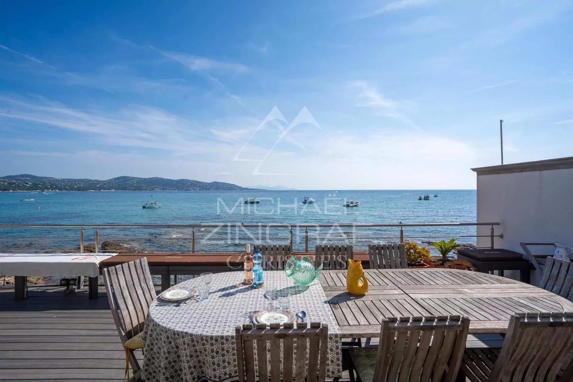 Waterfront villa in Sainte-Maxime Terrace with sea view in Sainte-Maxime, table set for an outdoor meal.