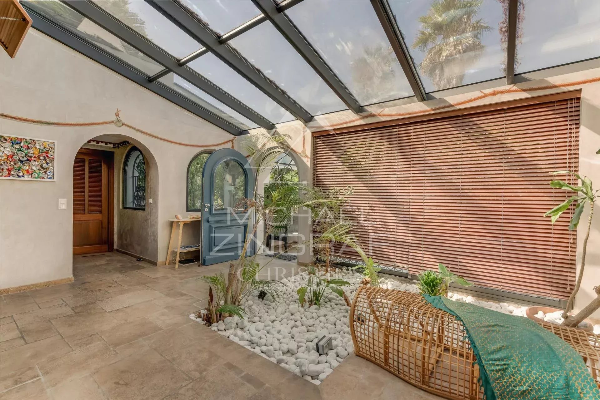 Interior of a villa in Sainte-Maxime Interior of a villa in Sainte-Maxime with a bright space and plants.