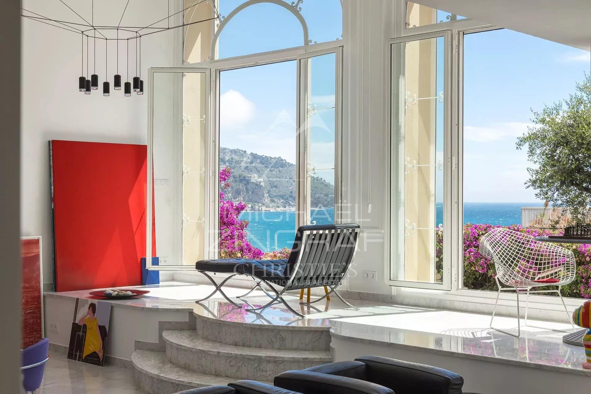 Belle Époque apartment in Menton Interior of a Belle Époque style apartment with sea view in Menton, windows open to the sea.