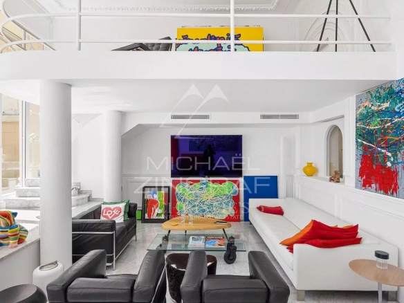 Interior of an elegant apartment with a spacious living room and works of art, Menton.