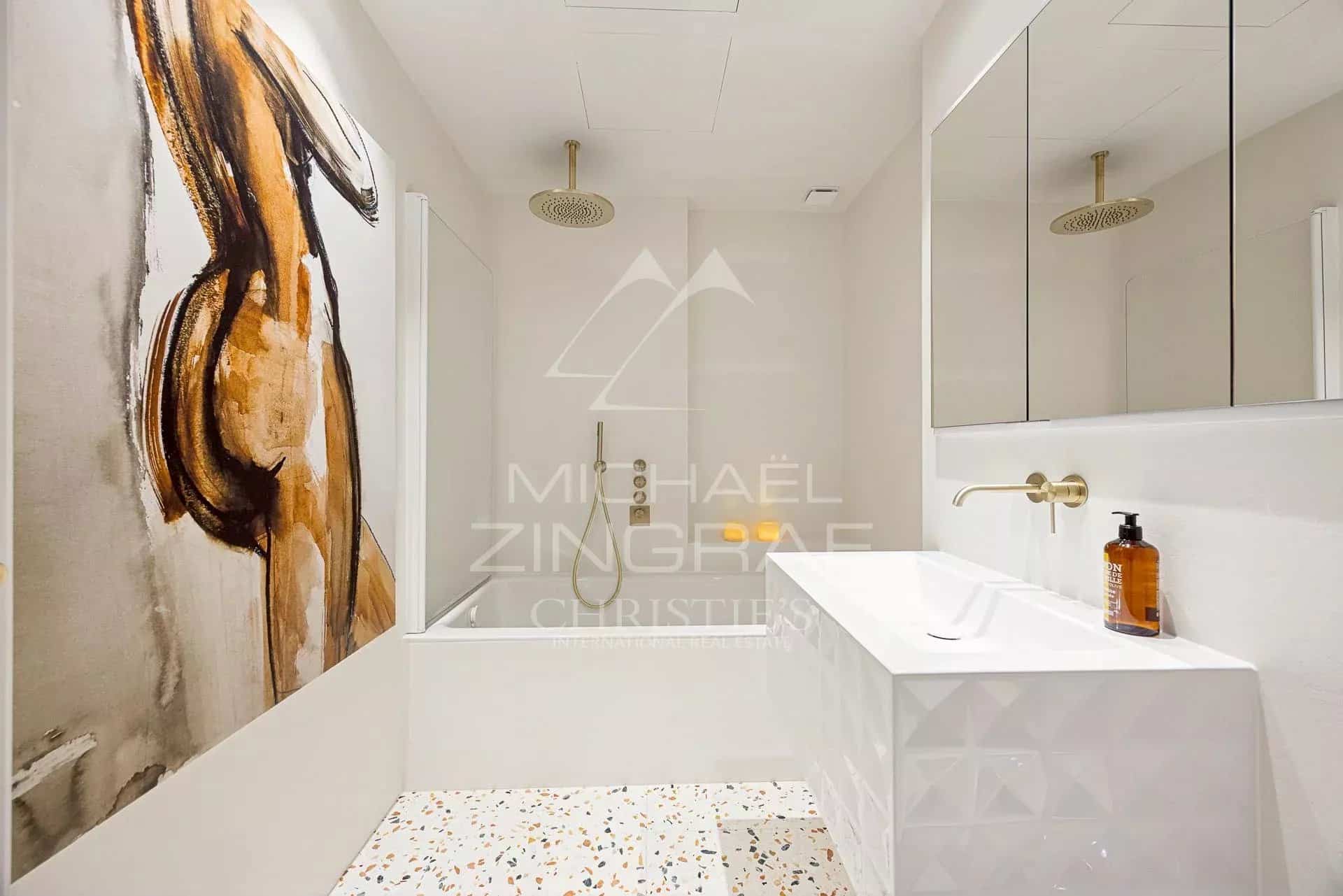 Bathroom of a Belle Époque apartment in Menton Modern bathroom with shower and sink in a Belle Époque style apartment in Menton.