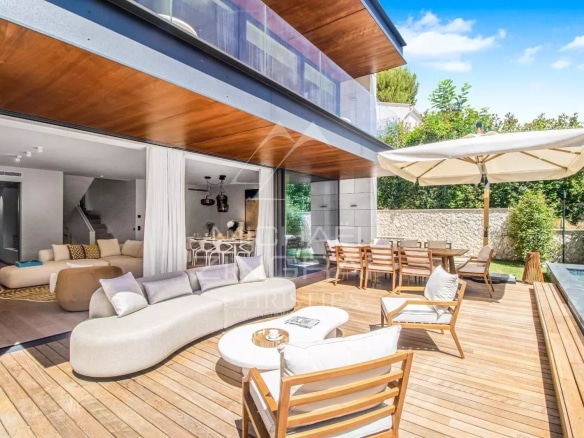 Terrace of a contemporary villa with modern furniture and swimming pool in Saint-Jean-Cap-Ferrat.
