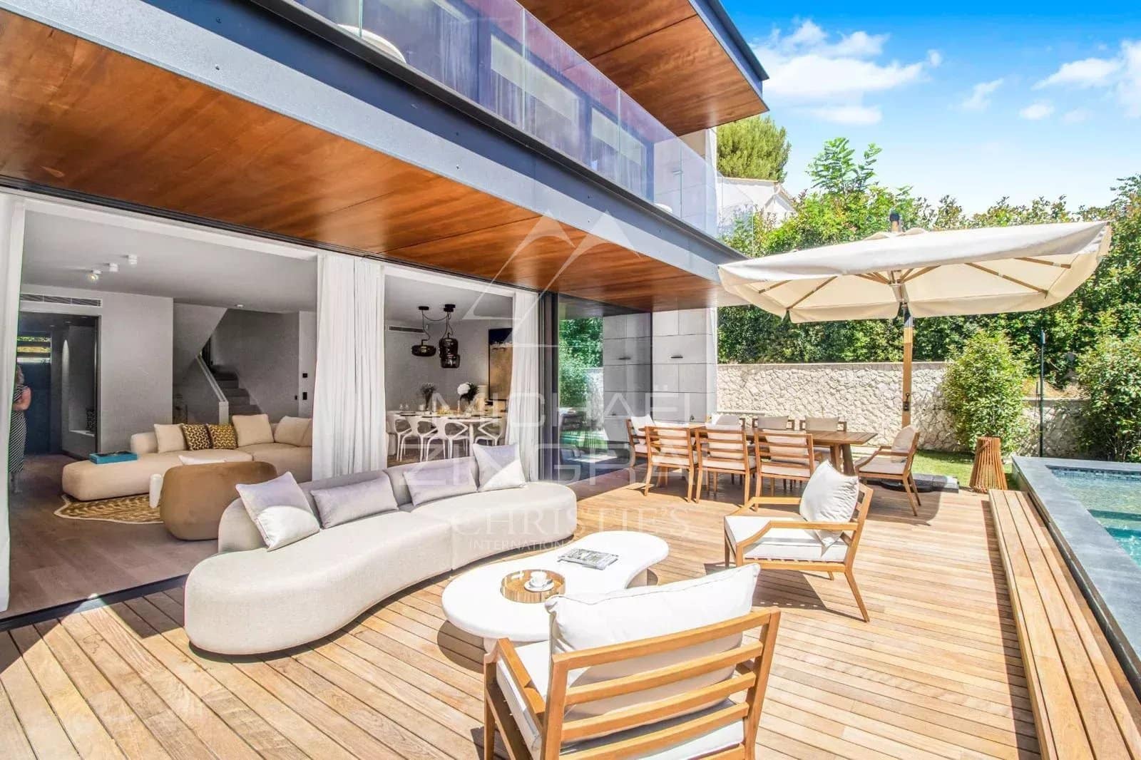 Terrace of a contemporary villa with modern furniture and swimming pool in Saint-Jean-Cap-Ferrat.