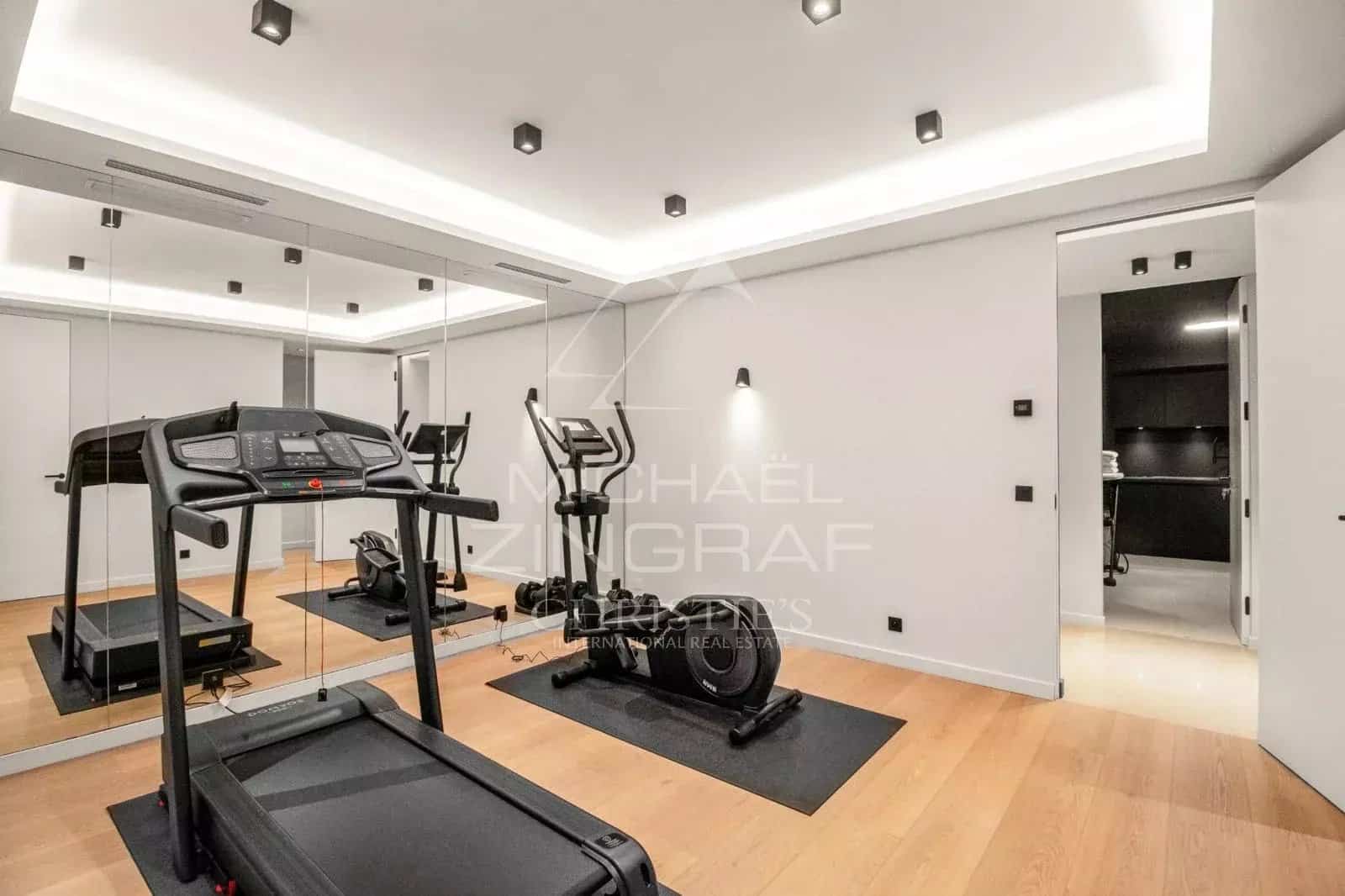 Modern gym with treadmill and exercise bike