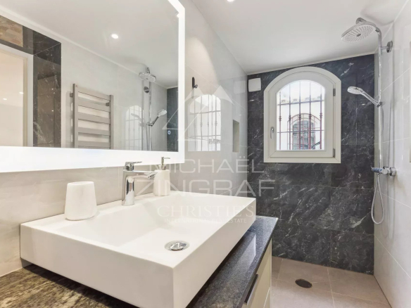 Modern bathroom with sink and shower in a duplex apartment in Villefranche-sur-Mer.