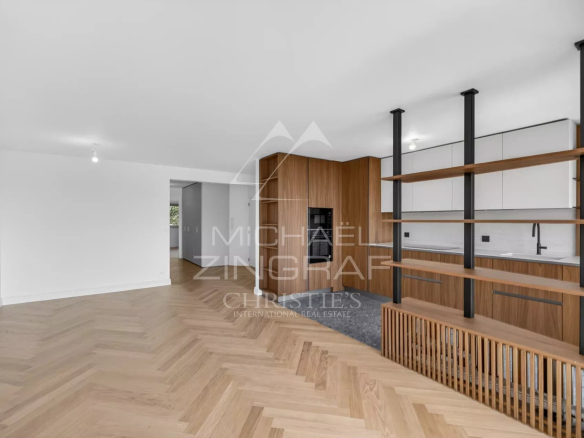 Interior of a renovated apartment with open-plan kitchen and bright living space in Villefranche-sur-Mer.