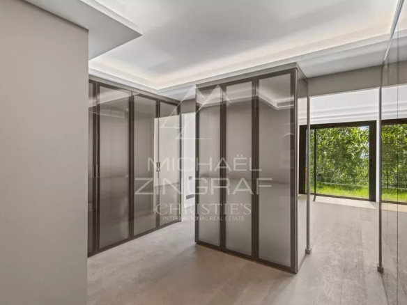 Interior of a new apartment with glass partition and access to a garden.