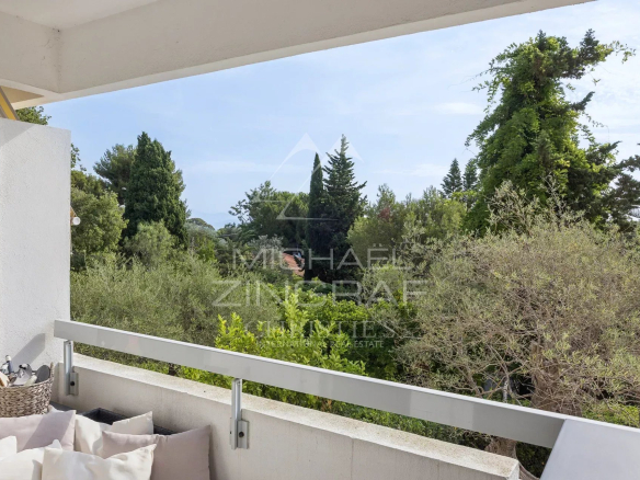 View from a balcony overlooking a wooded park in Cap d'Antibes.