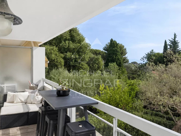 Balcony of an apartment overlooking a wooded park in Cap d'Antibes.