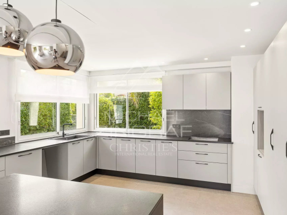 Modern and bright kitchen of a renovated contemporary villa in Antibes