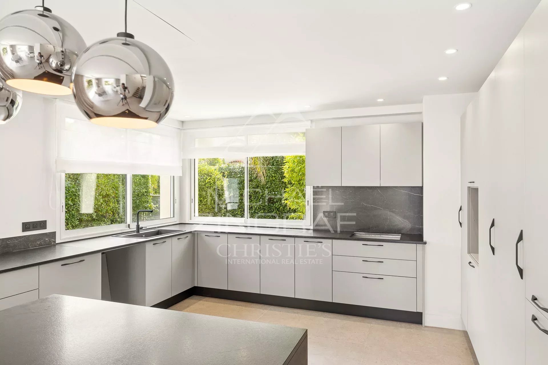 Modern and bright kitchen of a renovated contemporary villa in Antibes