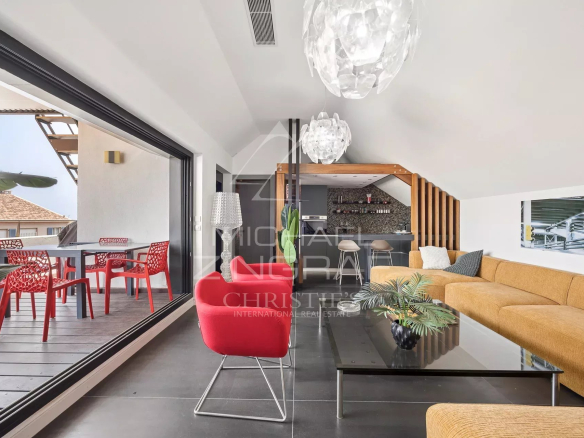 Interior of an architect-designed loft in Antibes with a modern living room and terrace.
