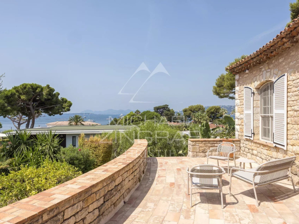 Stone terrace of a Provençal farmhouse with sea views at Cap d'Antibes.