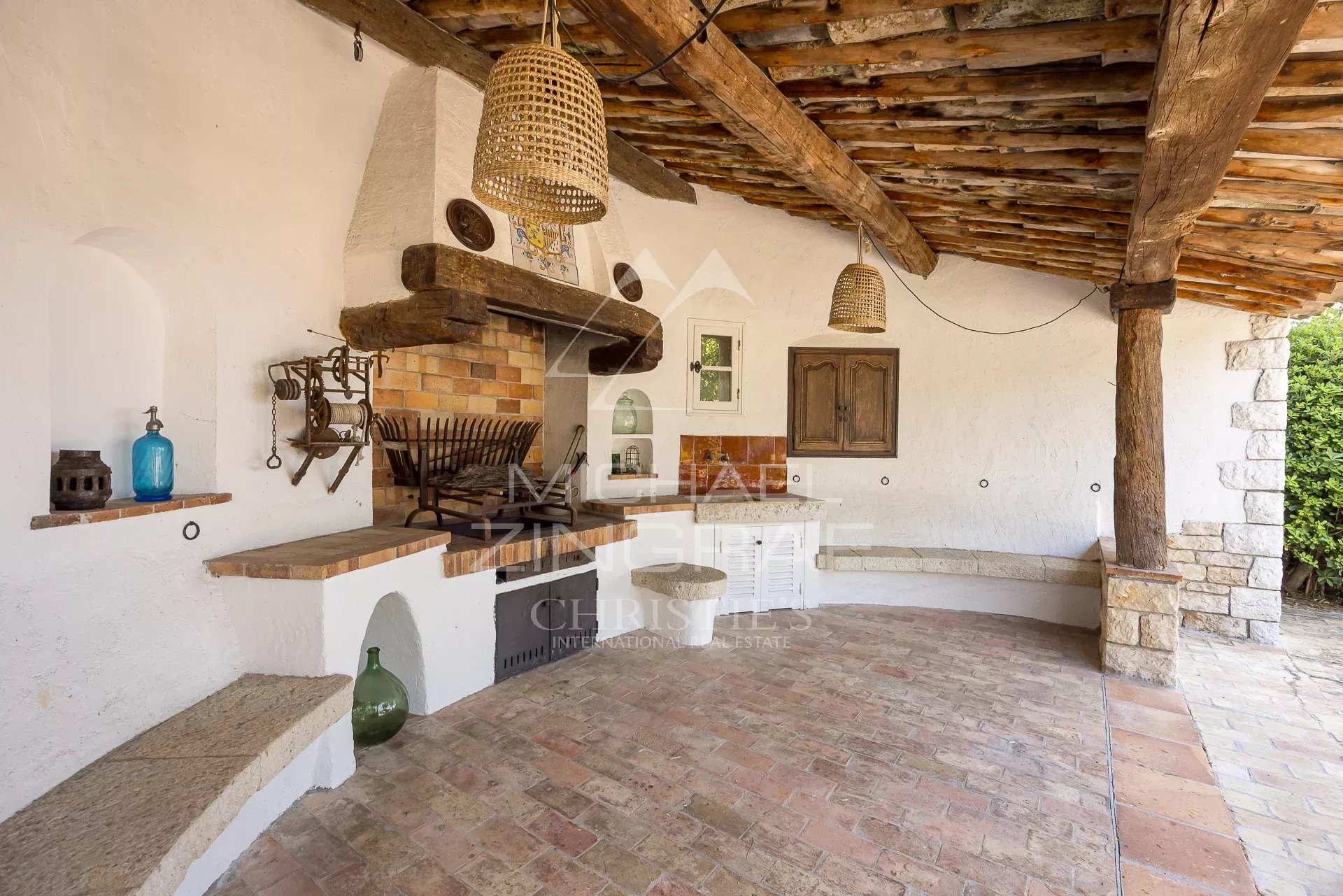 Terrace of a property in Cap d'Antibes Covered terrace with stone barbecue in a Provençal property in Cap d'Antibes.