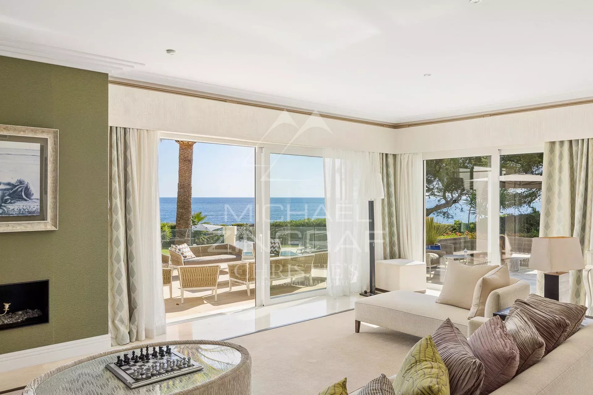 Interior of a villa in Cap d'Antibes Interior of a villa in Cap d'Antibes with sea view, bright living room and elegant decor.
