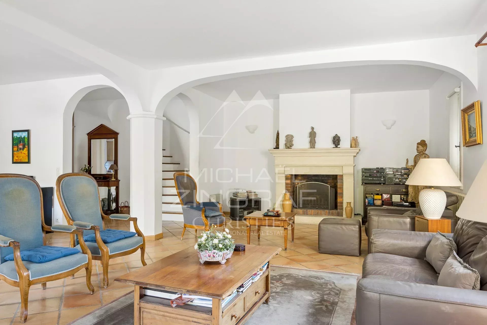 Living room of a house in Antibes Interior of a house in Antibes with a spacious living room and a fireplace.