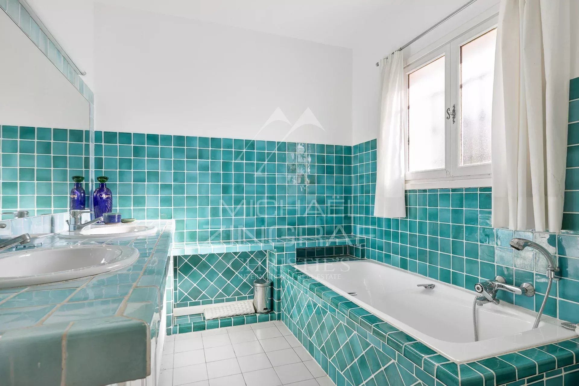 Modern bathroom Bathroom with turquoise tiles, bathtub and sink.