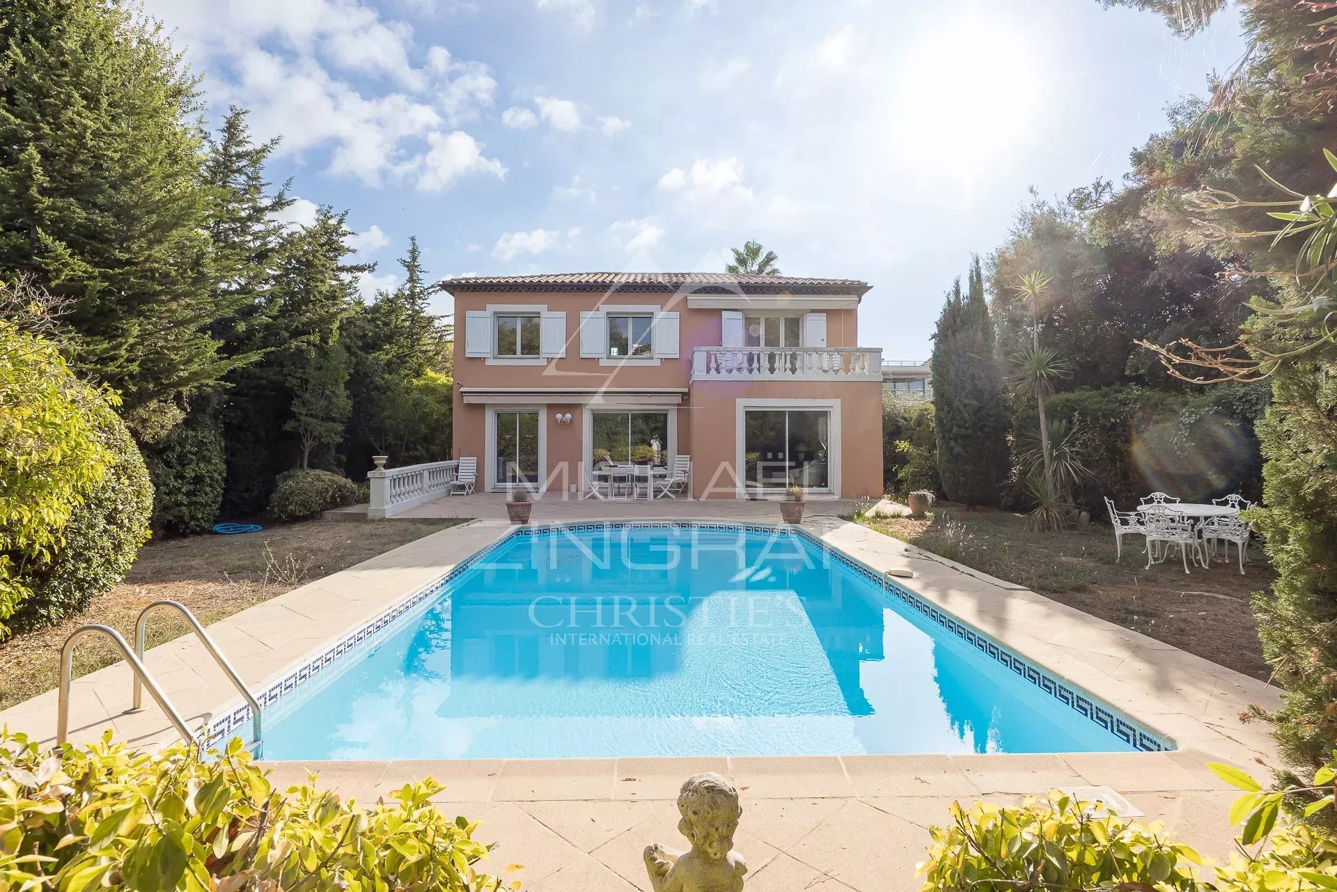 Property in Antibes with swimming pool House with swimming pool surrounded by greenery in Antibes, France.