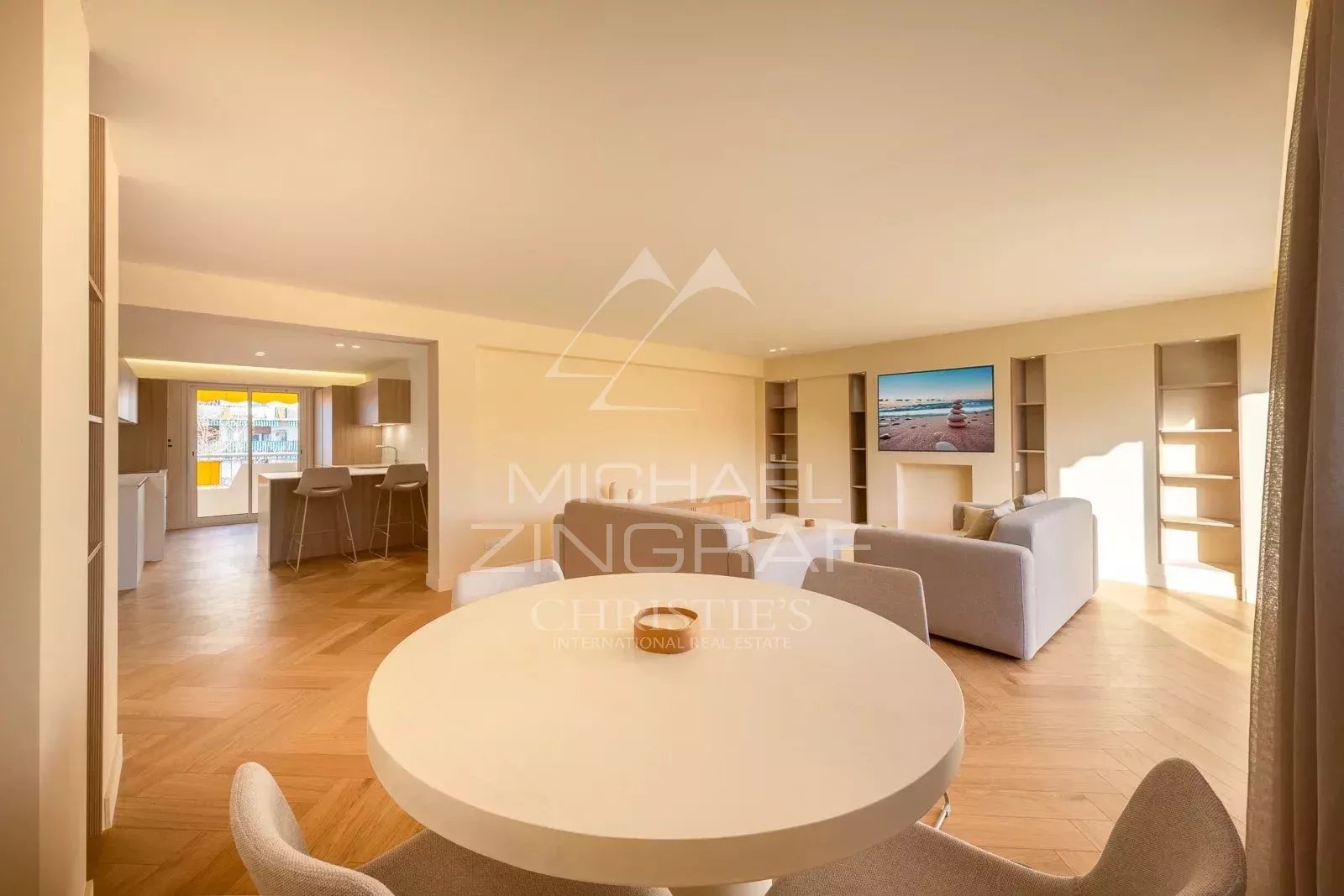 Interior of a renovated apartment in Antibes, with a bright living room and modern kitchen.