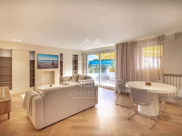 Bright living room of a renovated apartment in Antibes with sea view.