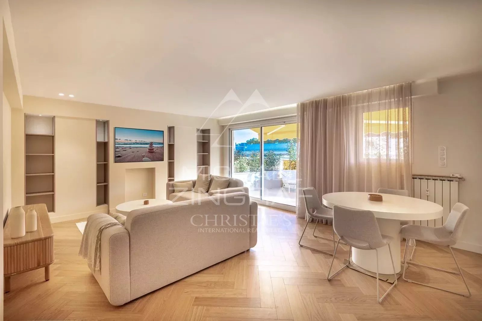 Bright living room of a renovated apartment in Antibes with sea view.