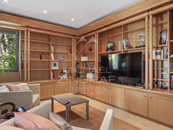 Interior of a contemporary villa with library and television, Cap d'Antibes.