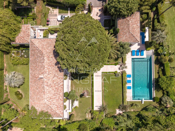 Aerial view of a contemporary villa with swimming pool and garden in Cap d'Antibes.