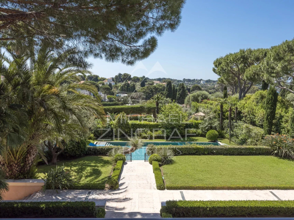 View of a landscaped garden with swimming pool in a contemporary villa in Cap d'Antibes.