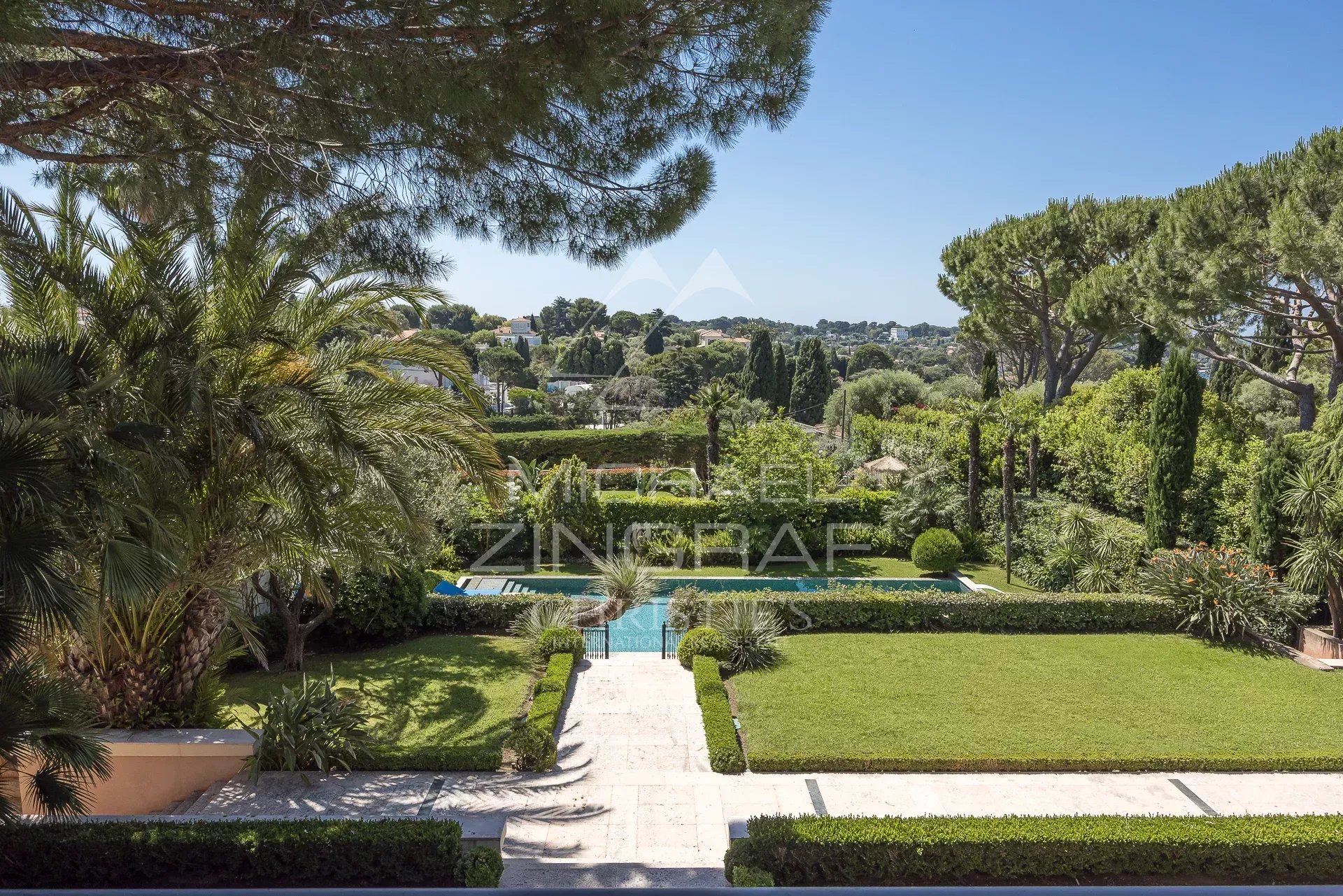 Landscaped garden at Cap d'Antibes View of a landscaped garden with swimming pool in a contemporary villa in Cap d'Antibes.