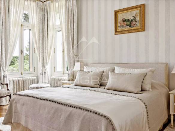 Room in a Belle Époque property with bright windows and elegant decor.