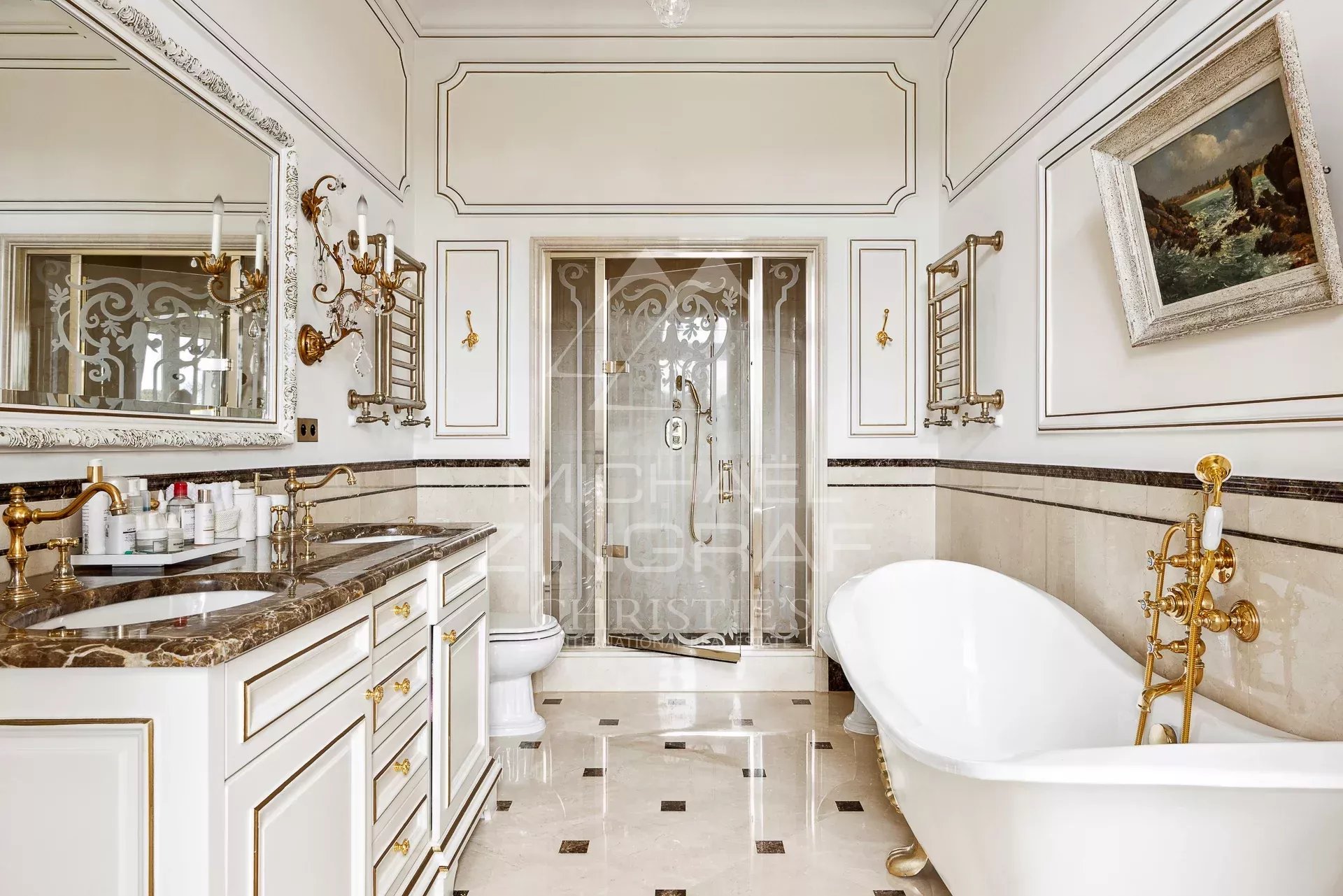 Luxurious bathroom with freestanding bathtub and shower, decorated in an elegant style.