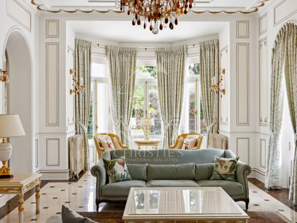 Interior of a Belle Époque property with a bright living room and refined decor.