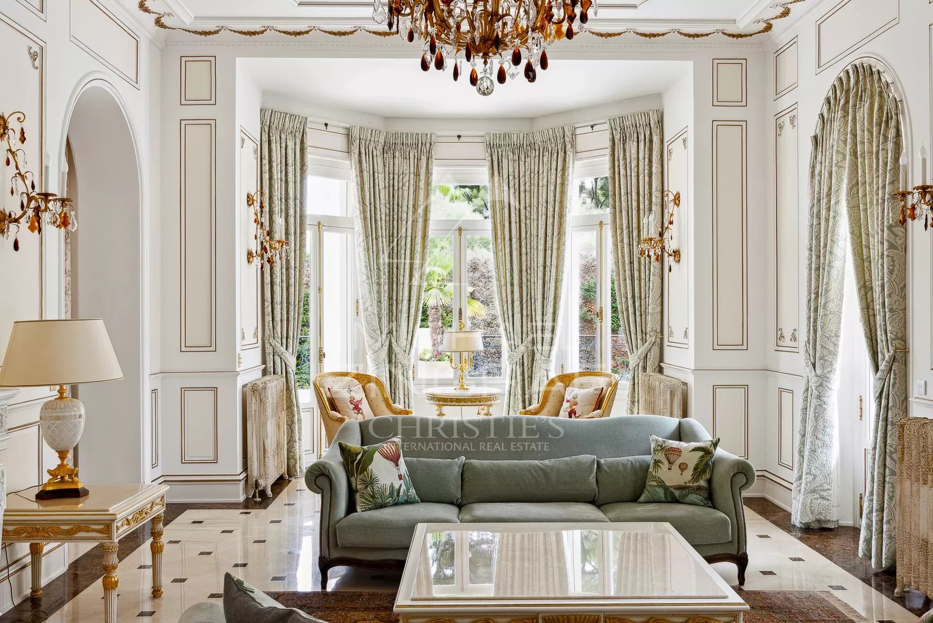 Interior of a Belle Époque property with a bright living room and refined decor.