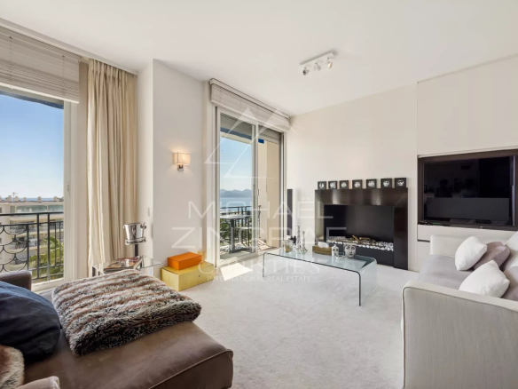 Interior of a penthouse in Cannes with sea view, bright and modern living room.