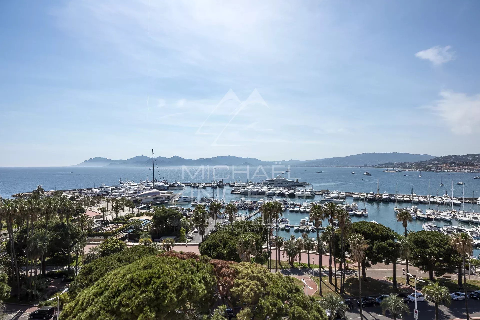 Panoramic view of the port of Cannes and the sea from a penthouse.