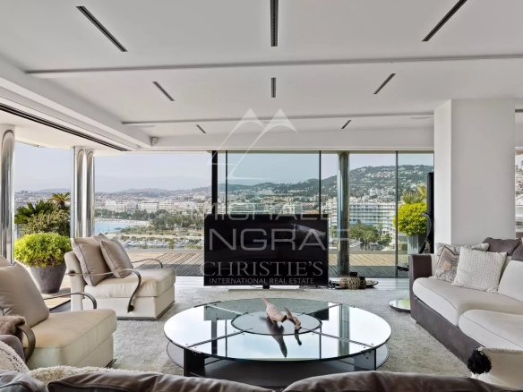 Interior of a modern penthouse with sea views in Cannes, spacious and bright living room.