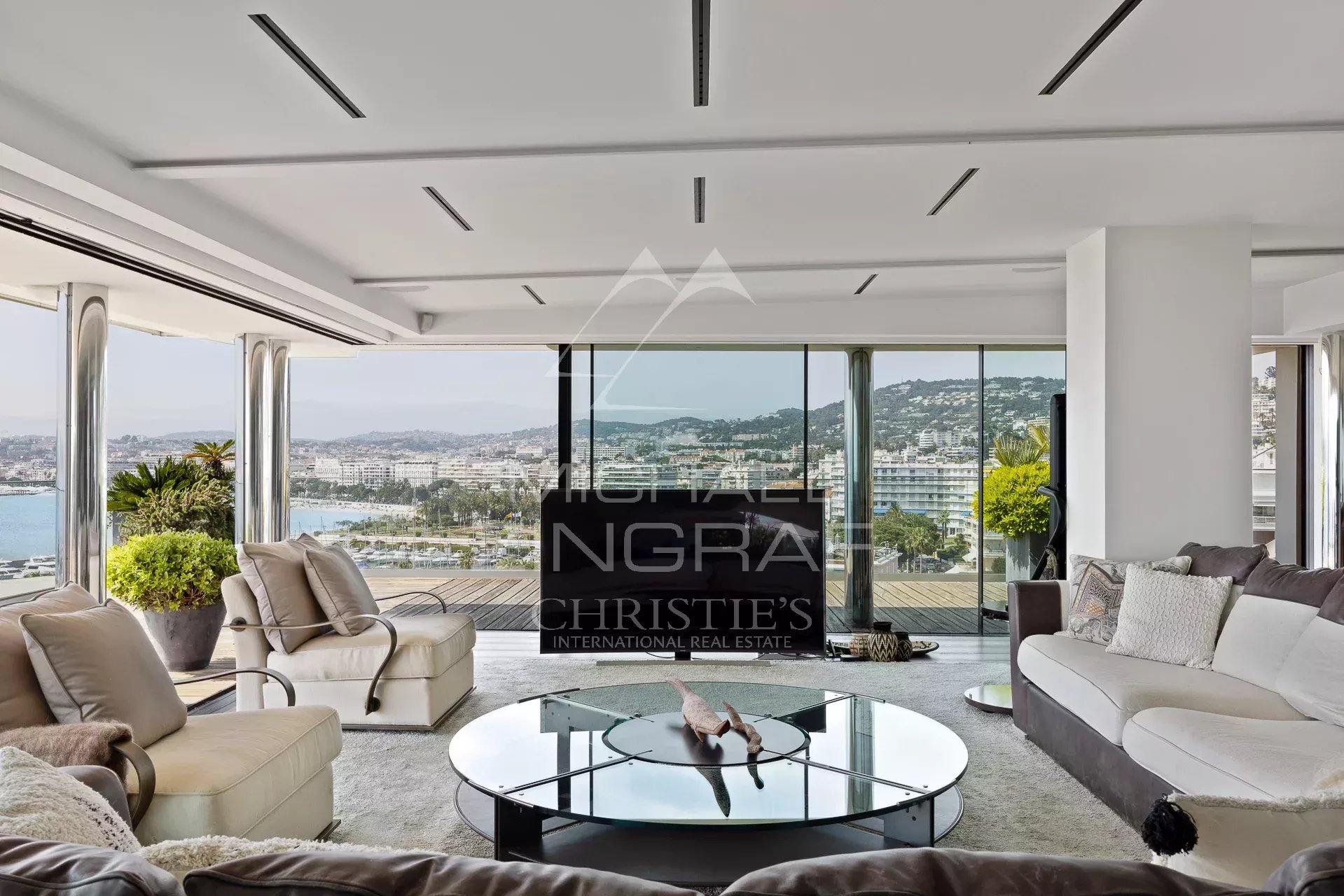 Interior of a modern penthouse with sea views in Cannes, spacious and bright living room.